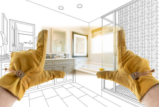 istock Male Contractor Hands Framing Completed Section of Bathroom Over Bathroom Drawing 1204515941