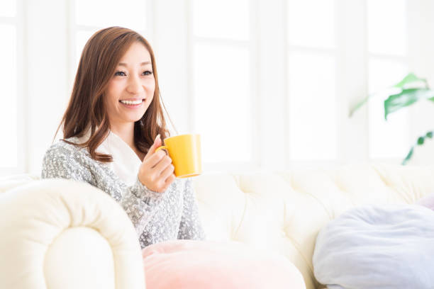 istock asian woman who drink coffee 1204515945