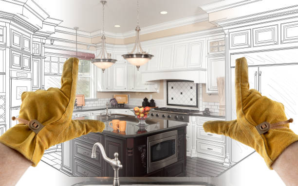 istock Male Contractor Hands Framing Completed Section of Custom Kitchen Design Drawing 1204515952