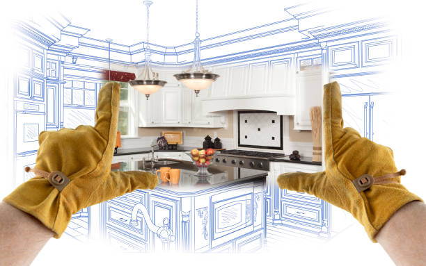 istock Male Contractor Hands Framing Completed Section of Custom Kitchen Design Drawing 1204515955