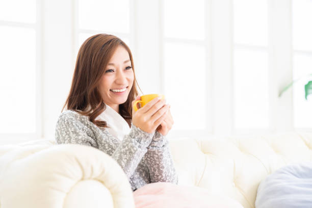 istock asian woman who drink coffee 1204516013
