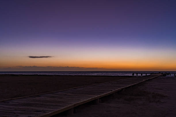 istock Wooden dock  with beautiful sunset at the background 1204516711