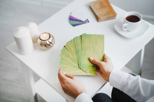 istock Woman hold metaphorical associative cards. 1204517197
