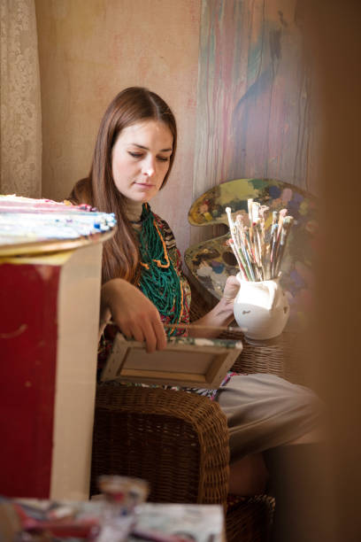 istock Beautiful Woman Painter in her Art Studio 1204517938