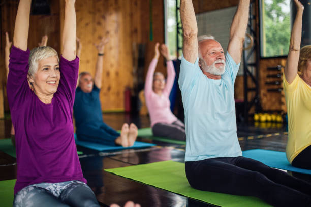 istock Group of seniors staying active with yoga 1204517946