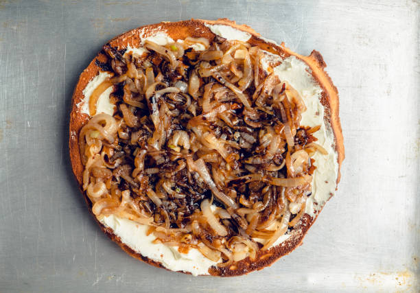 istock Homemade pizza with goat cheese, caramelized onion and balsamic vinegar 1204525678