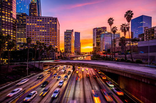 Busy traffic in Downtown Los Angeles at sunset.