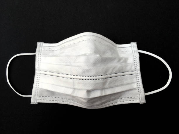 istock protect from corona virus with medical ear loop mask 1204528948