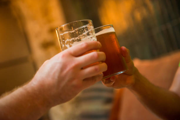 istock Two male cheers with beer 1204529079