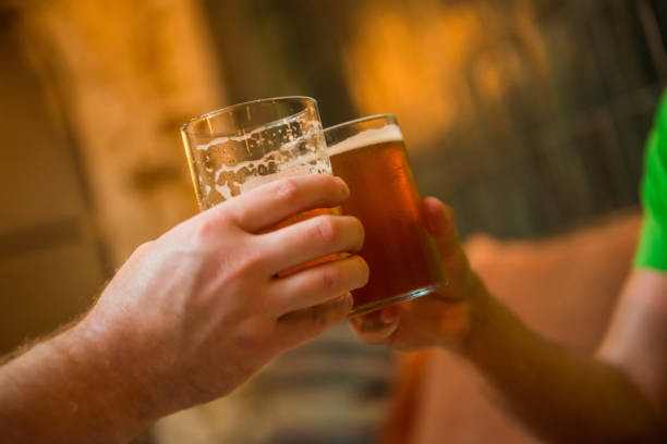 istock Two male cheers with beer 1204529081