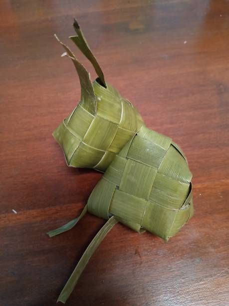 istock Kupat from rice wrapped in young coconut leaves 1204530416