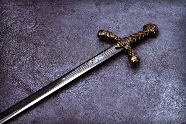 istock Knight's hilt on a gray marble background 1204535524