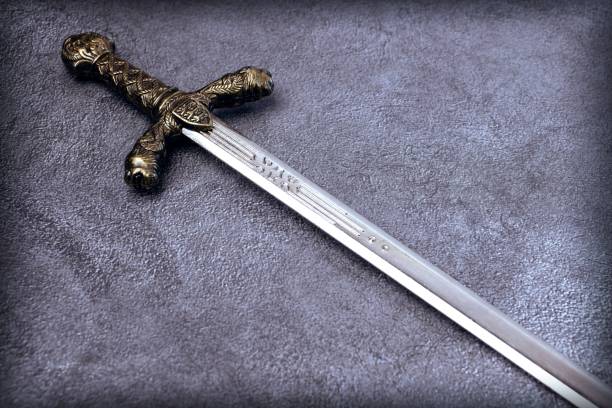 istock Knight's hilt on a gray marble background 1204535526
