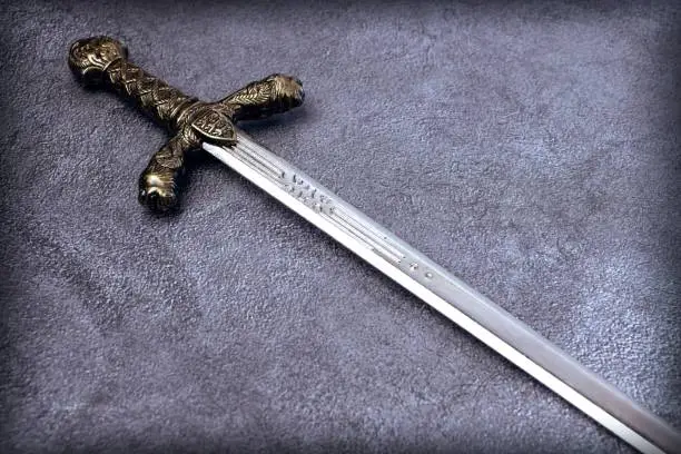 Knight's hilt on a gray marble background