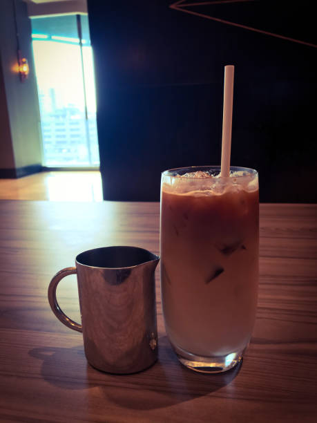 Ice coffee on wooden table vintage tone