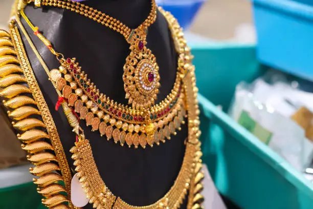 Photo of Traditional And Cultural Golden Colorful Ornamental Designer Necklace Jewelry or Jewellery For Girls And Women Decorated On Black Mannequin