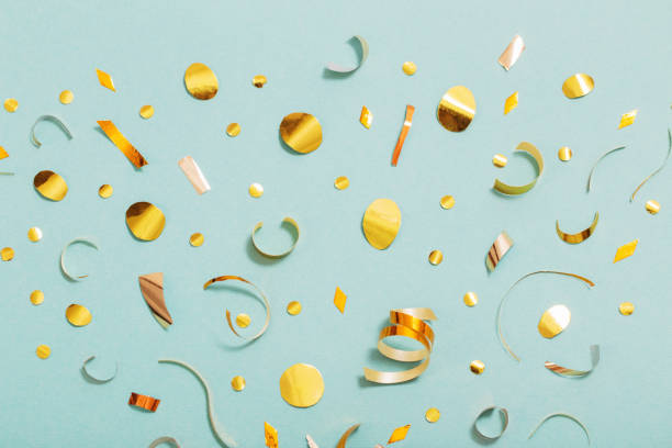 istock golden  confetti on green background 1204538737