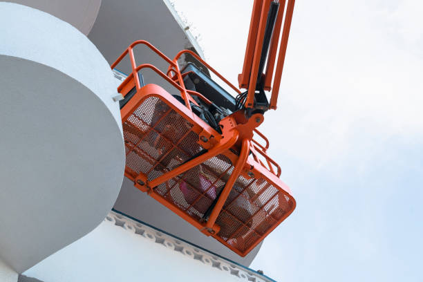 istock Man on a telescopic boom lift platform 1204539977