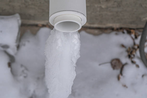 istock Furnace exhaust vent with Icicle from dripping water 1204544772