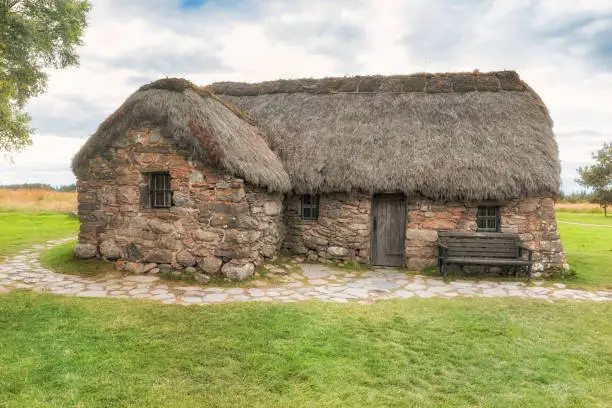 old Scottish stone house with thatched roof