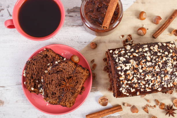 istock Black coffee, dark cake with chocolate, cocoa and plum jam, delicious dessert 1204547024