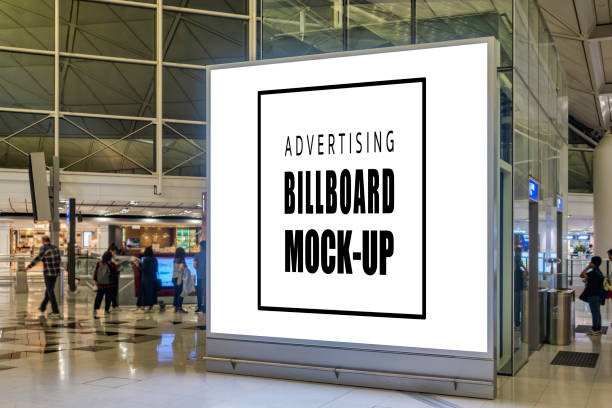 istock Mock up blank vertical billboard near elevators at airport 1204547173