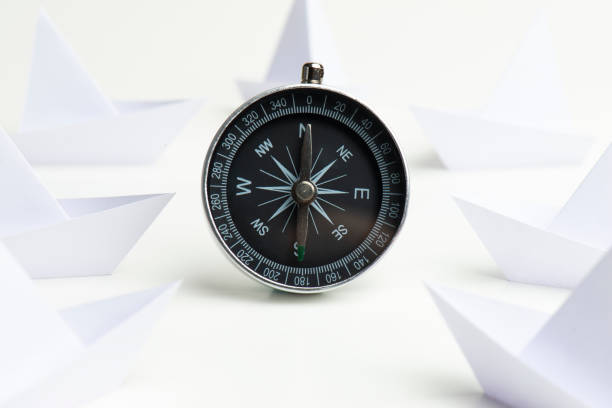 istock White Paper Boats With Compass 1204551075