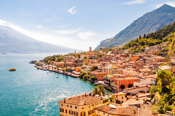 Limone Sul Garda cityscape on the shore of Garda lake surrounded by scenic Northern Italian nature. Amazing Italian cities of Lombardy Limone Sul Garda cityscape on the shore of Garda lake surrounded by scenic Northern Italian nature. Amazing Italian cities italian lake district photos stock pictures, royalty-free photos & images