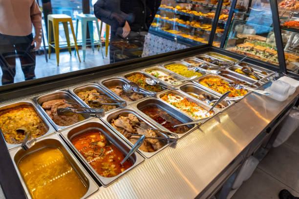 istock Various cooked meals in steel trays in buffet 1204553714