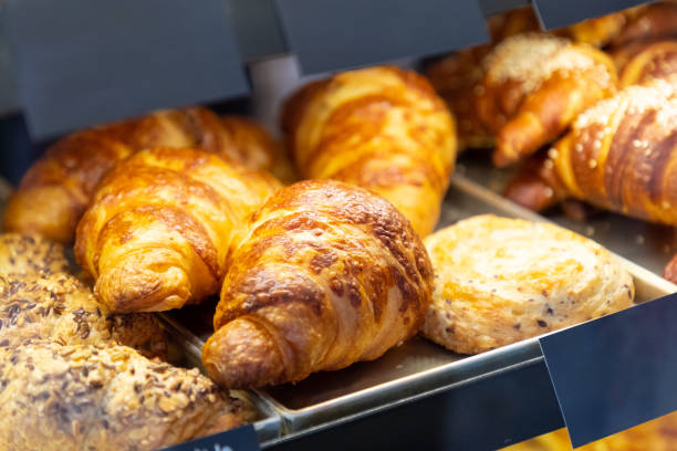 istock Croissants with melted cheese on a tray 1204553727