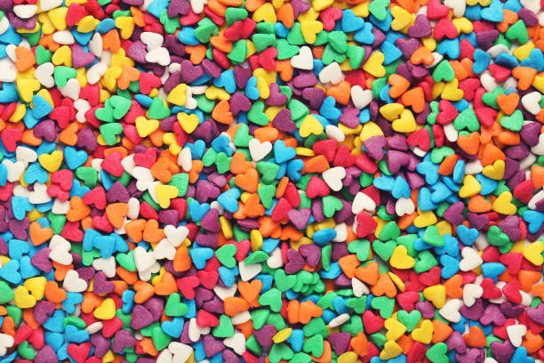 istock Background of colorful heart shaped sprinkles 1204558626