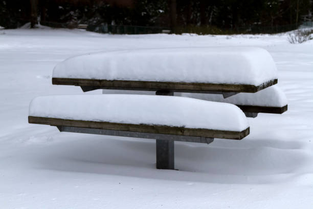 istock snow-covered picnic table on the ground, Burnaby, BC, Canada 1204558922