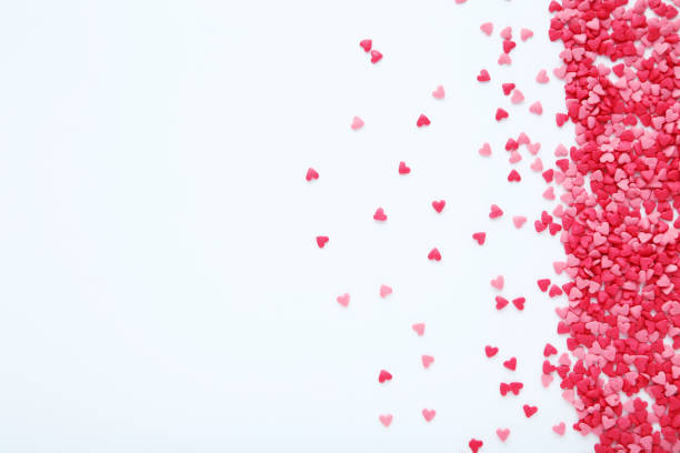 istock Heart shaped sprinkles on white background 1204559061