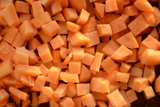 istock Fresh carrot on a light wooden table. 1204559132