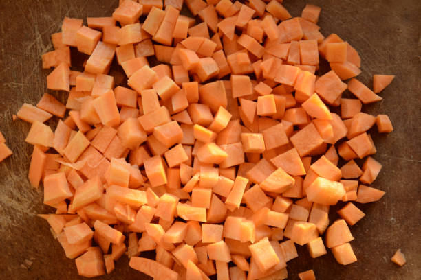 istock Fresh carrot on a light wooden table. 1204559136