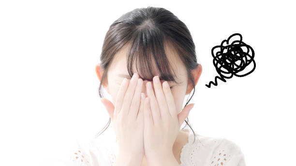 istock Asian woman hiding her face. 1204560817