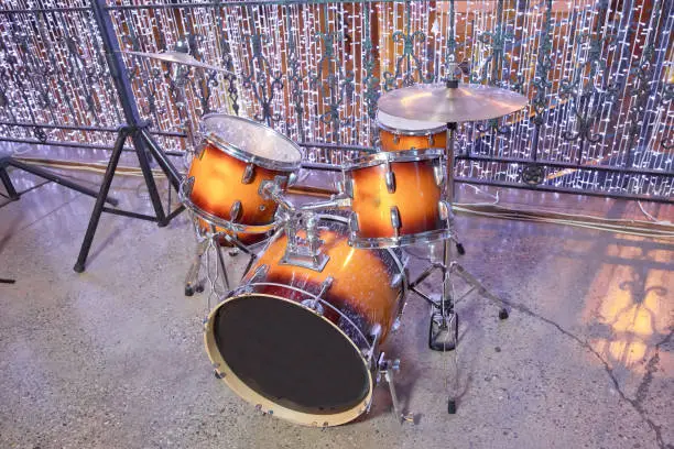 Photo of Drum-kit, drum-set, percussion instrument, drumkit . Drum set in sound recording studio. Drum kit in close up view . Drum kit, percussion instrument, beat set, nobody .