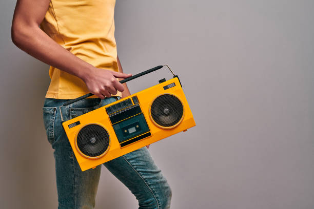 istock Boy retro music lover on isolated gray background 1204565811