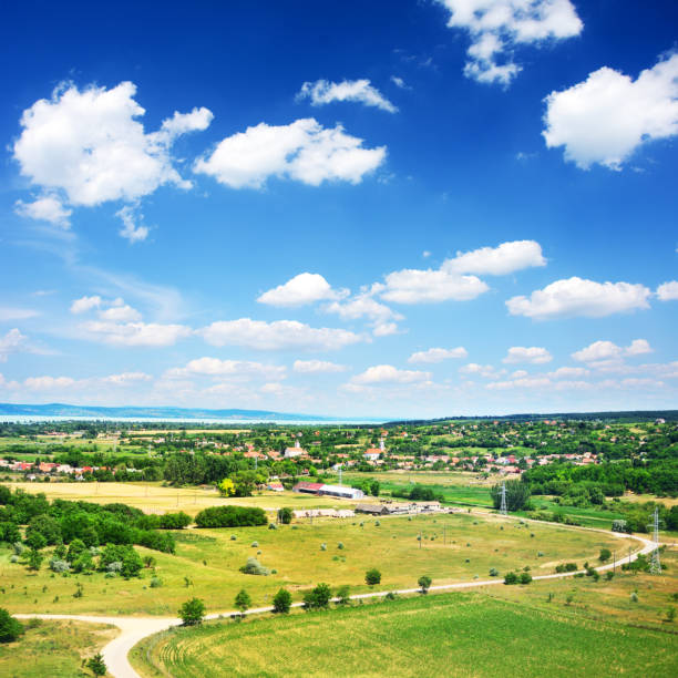 A house on a hill. Grass. Sky. Outdoor. Field. Mountain
