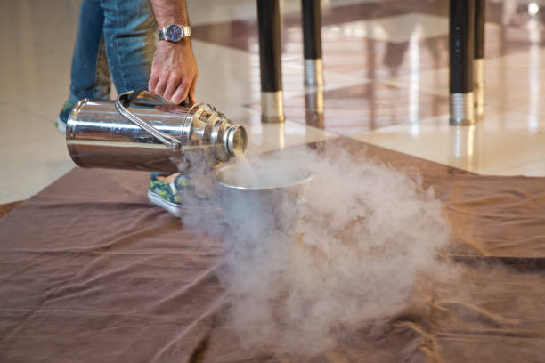 istock Chemical experiment, show with liquid nitrogen . Steam of Nitrogen Created from Liquid Nitrogen Exposed to Temperatures . 1204569661