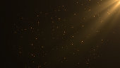 Abstract background beautyful gold particles with shining golden Floating Dust Particles Flare.