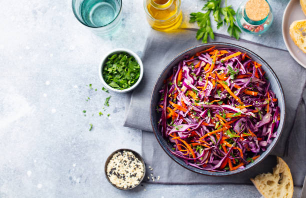 istock Red cabbage salad, Coleslaw in a bowl. Grey background. Top view. Copy space. 1204576810
