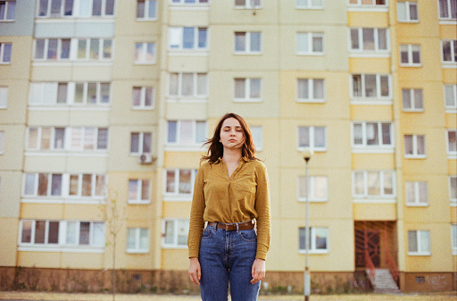 Young Caucasian woman  standing near the  colorful building in Brest. Belarus