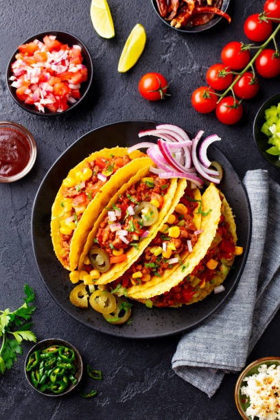 istock Taco with beef, Mexican traditional cuisine. Dark background. Top view. 1204580256