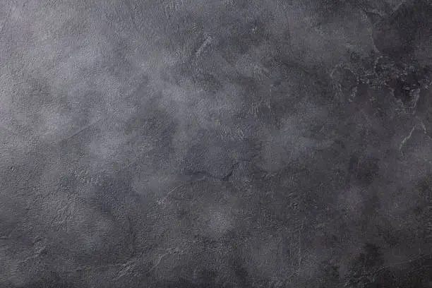 Natural black slate stone background pattern with high resolution. Top view. Copy space.