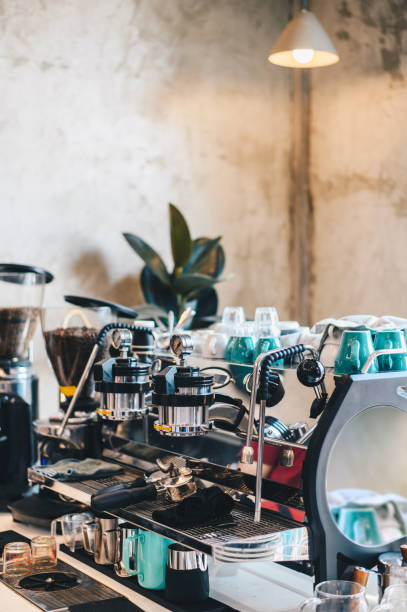 istock Professional coffee machine in cafe with cafe decoration in background 1204580586