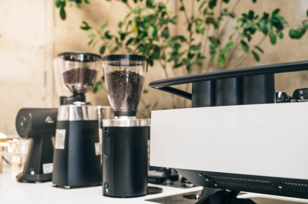 istock Professional coffee machine in cafe with cafe decoration in background 1204580588