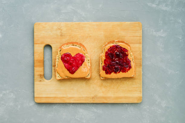 istock Peanut butter jelly heart sandwich 1204583166