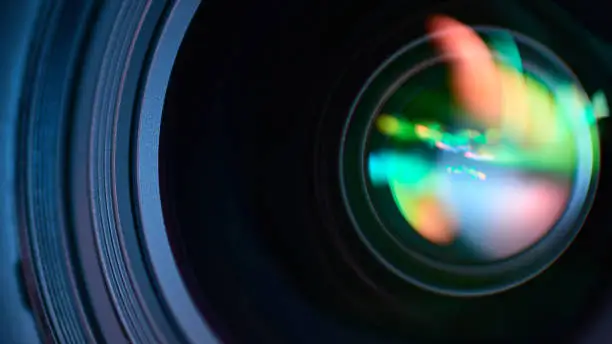 Macro photography of a DSLR lens with a colorful glare