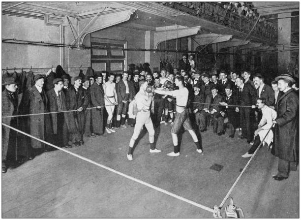 Antique photograph of the British Empire: Boxing at the Regent Street Polytechnic Antique photograph of the British Empire: Boxing at the Regent Street Polytechnic combat sport photos stock illustrations